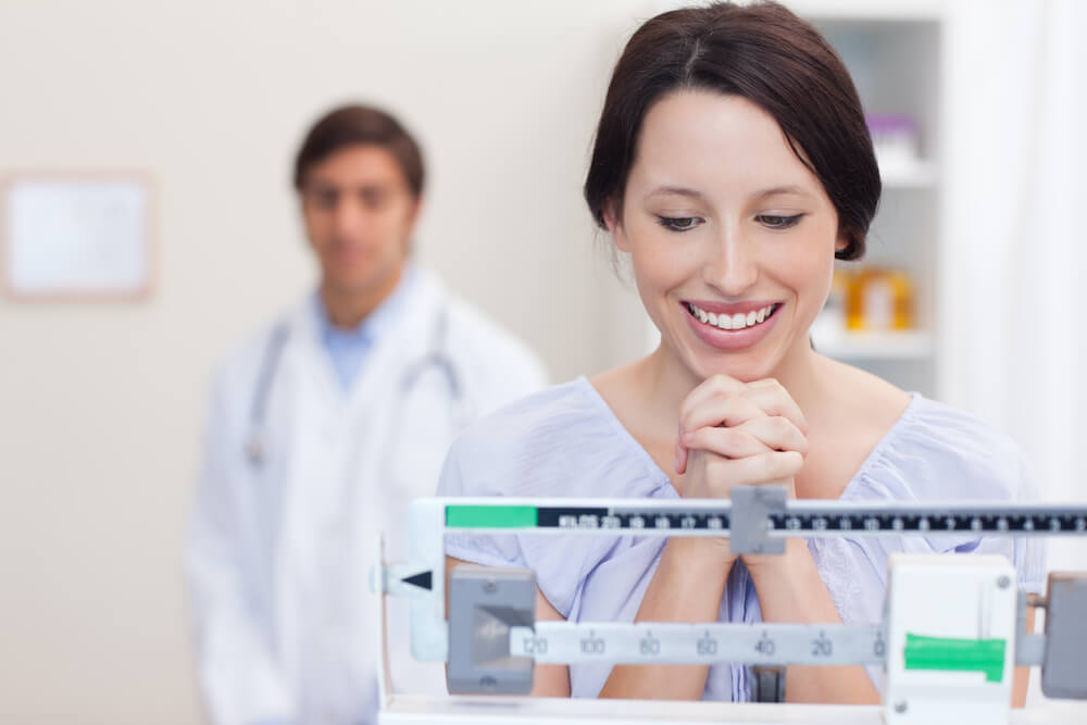 Women looking pleased at the scale number