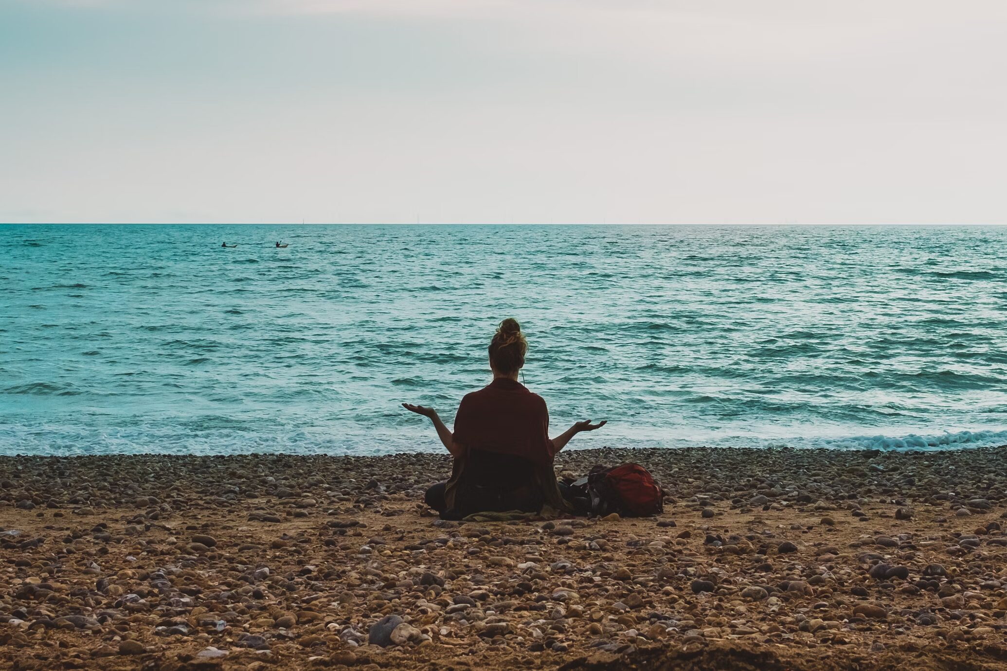 person practicing mindfulness at the beach